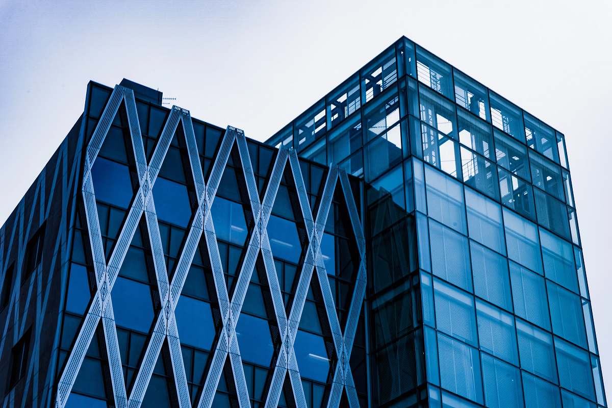 office building photo of building top under gray sky architecture
